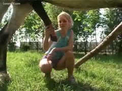 Beautiful Blonde Playing with Horse's Dick